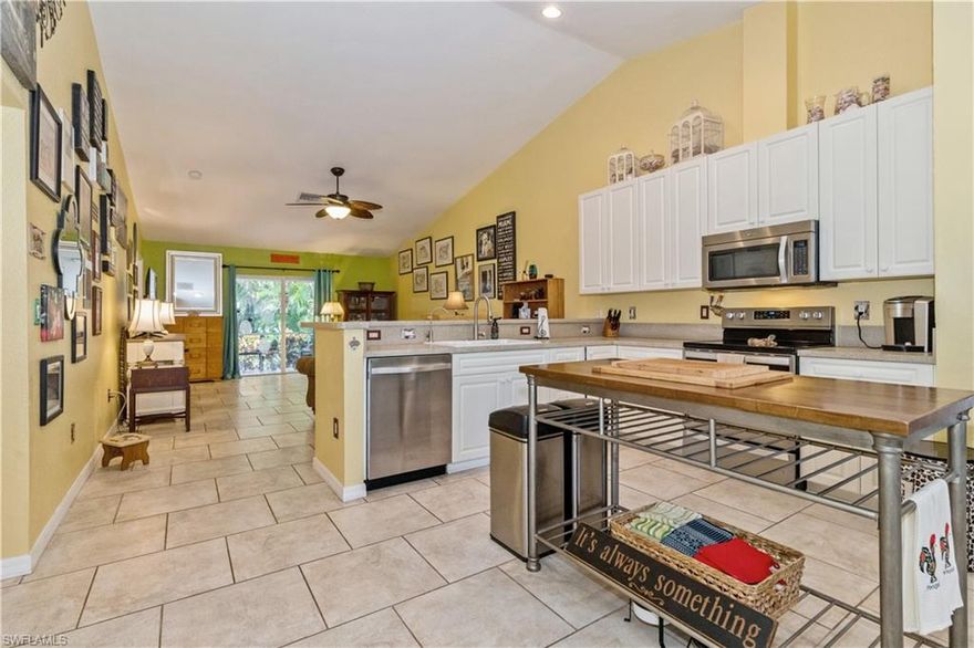 Welcome to your new condo in the heart of the Pine Island! This great home boasts a spacious layout with modern amenities that will make you feel right at home. The sleek stainless steel appliances in the kitchen are perfect for whipping up gourmet meals, while the tile flooring throughout adds a touch of elegance to the entire home. With a one-car garage and a large driveway, parking will never be an issue. Pull into the attached garage to park and dodge the summer rains! The real gem of this condo is the great location. Just a short walk to the community pool, a handful of stores and restaurants, and library. And if you're in the mood for some outdoor fun, the pool is just steps away from Phillips Park. Located at "the Center," you are just seconds away from everything! And with a quiet neighborhood setting, you'll have the perfect balance of convenience and tranquility. Don't miss out on this incredible opportunity to live on an island in Paradise.