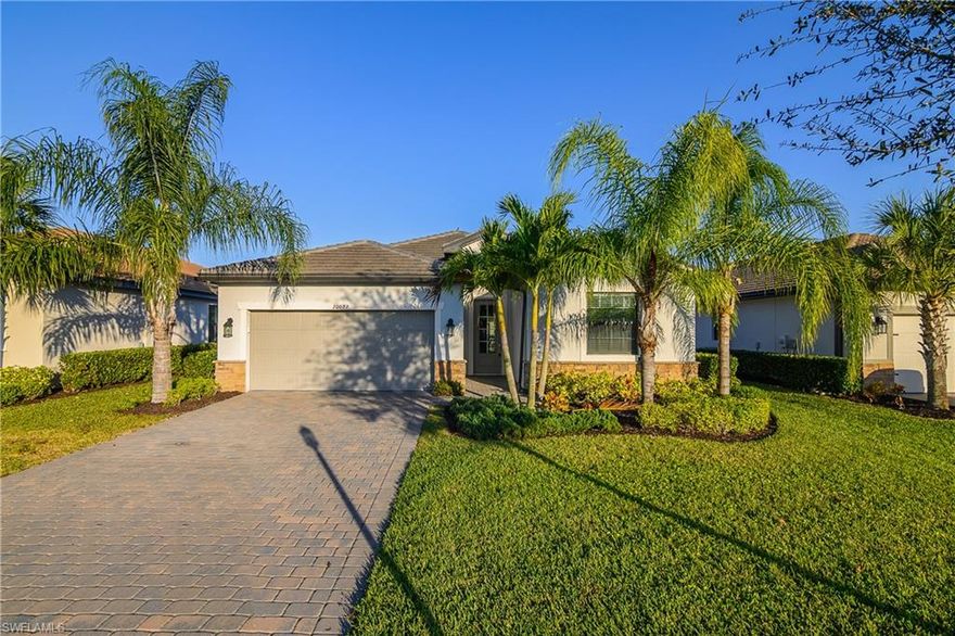 This four bedroom, three bathroom home with a two car garage is located in the sought after Verdana Village community in Estero, Florida. The exterior features a paver driveway that leads to a clean and well maintained front elevation, while the paver lanai at the rear of the home provides a finished outdoor space that connects directly to the interior living area. Inside, the home offers a functional and well defined layout with a comfortable flow between rooms. The main living area opens to the lanai through sliding glass doors, allowing natural light to fill the space and creating a seamless connection between indoor and outdoor areas. Custom wall molding accents the entryway, adding visual interest as soon as you enter the home. The living room features custom TV wall molding that serves as a focal point without overpowering the space. The kitchen is centrally located and includes an island that provides additional prep space and seating, along with a pantry for storage. A backsplash adds a finished look and complements the overall design. The kitchen is positioned to remain connected to the living and dining areas, supporting everyday use and gatherings without feeling crowded. The primary bedroom is finished with plank flooring and offers a comfortable retreat within the home. The ensuite bathroom includes a framed mirror and a clean, cohesive layout. Both additional bathrooms also feature framed mirrors, maintaining a consistent design throughout. The remaining bedrooms are well proportioned and offer flexibility for a variety of needs, with easy access to the secondary bathrooms. A custom paint job throughout the home adds character while keeping the overall look neutral and polished. Each space feels intentional, with finishes that work together to create a cohesive interior. Verdana Village offers a wide range of community amenities designed for daily enjoyment. Residents have access to a resort style pool, fitness center, indoor pickleball and tennis courts, and additional recreational spaces. The community also includes walking paths, green spaces, and gathering areas that encourage an active and connected lifestyle. Verdana Village is conveniently located near shopping, dining, and major roadways, making it easy to enjoy everything Estero and the surrounding areas have to offer. Some photos have been digitally staged