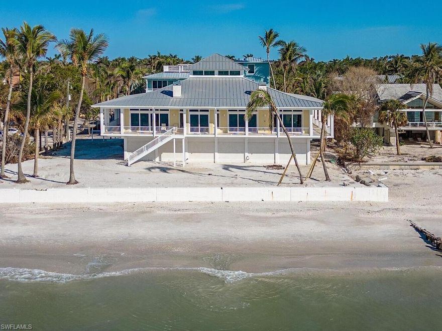 Take advantage of this rarely available opportunity to sit on your private wraparound porch while watching the sunset over the Gulf of Mexico every night! One of a kind BEACH FRONT home with 135 feet on the gorgeous, world renowned, white-sand beaches of Naples!  This custom home was built in 2015 and residence sustained no damage from hurricane Ian.  The chef's kitchen features high-end appliances, elegant countertops, and overlooks the living area with fireplace. Vast attention to detail can be found throughout showcasing hardwood flooring and soaring, coffered and bead beach board wood ceilings that highlight exquisite architectural detail and accent lighting. Residence is finished with a whole house, generator, 8+ car garage, three fireplaces, large bonus room, elevator, impact doors/windows, and electric hurricane shutters. This is truly a unique opportunity to experience beachfront living at its finest. Ideally located just minutes from 3rd Street South’s and 5th Avenue South's fine dining, world-class shopping and white-sand beaches. Port Royal Associate Membership Eligible.