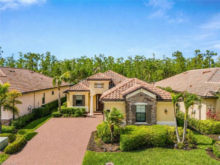Welcome to 17270 Galway Run, a beautifully upgraded preserve-view home located within the resort-style community of Bonita National Golf & Country Club. This Victoria floor plan offers a perfect blend of elegance, comfort, and outdoor living, this residence captures everything buyers love about the Southwest Florida lifestyle. The home features wood plank tile flooring throughout, creating a stylish and cohesive look across the entire living space. The open-concept design allows for effortless flow between the kitchen, dining area, and living room, all while taking full advantage of the natural light and private preserve views beyond the lanai. Outdoor living takes center stage with a spacious screened lanai complete with a beautiful pool and spa, fully equipped outdoor kitchen, and generous covered seating area ideal for entertaining or relaxing year-round. The preserve setting provides exceptional privacy and a peaceful backdrop to enjoy morning coffee or evening sunsets. Additional upgrades include hurricane impact glass throughout the home and an electric roll-down shutter on the rear lanai for added convenience and storm protection. This home conveys with a social membership to Bonita National Golf & Country Club. Residents enjoy access to resort-style amenities including a lagoon-style pool with waterfall and lap lanes, poolside bar and grill, clubhouse dining, fitness center, tennis courts, spa services, and a full calendar of social activities. Bonita National’s prime location places you just minutes from world-class beaches, shopping, dining, entertainment, and Southwest Florida International Airport.