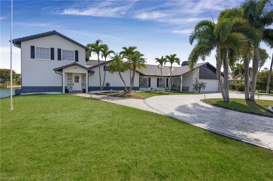 Don’t miss this truly one-of-a-kind waterfront estate in Cape Coral! Tucked away on a quiet cul-de-sac, this expansive property offers over 4,500 square feet of living space plus a private attached guest home—perfect for extended family, guests, or potential Airbnb income.

Situated on scenic Shamrock Lake, the home showcases breathtaking water views and a peaceful setting. Enjoy outdoor living at its finest with a new composite dock, complete with floating jet ski docks that convey with the sale.

Inside, you’ll find 6+ bedrooms and 3 full bathrooms, along with a bright sunroom that overlooks the pool and serene lake—an ideal spot to relax and unwind.  Floor plans are attached for your convenience.

Major updates provide peace of mind, including three A/C units (2025, 2024, and 2020) and a brand-new European tile-look metal roof installed in 2024, backed by a 60-year warranty.

Jet skis and furniture are negotiable. Electric is available at the dock (currently not operational).

This is a rare opportunity to own a spacious, waterfront retreat with incredible potential—schedule your showing today!