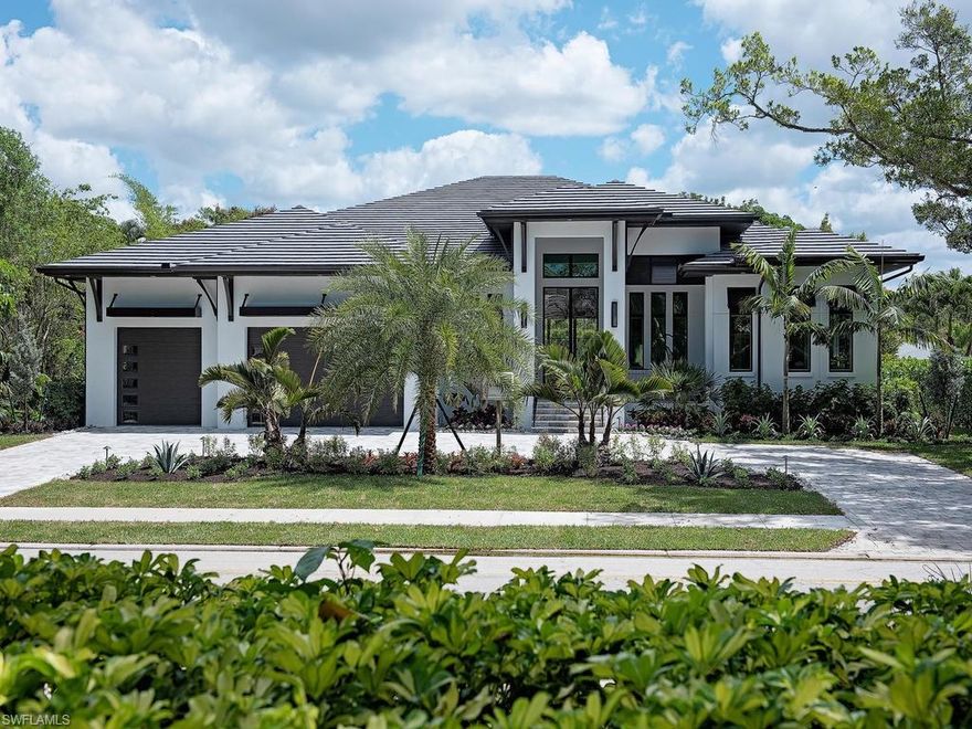 Enjoy the luxury lifestyle from the comfort of your custom contemporary open concept home! Located just blocks from the beach, this residence offers exquisite architectural details including exposed wood beams and ceiling details, wood and tile flooring and cathedral entry door. With quality finishes such as all-wood custom cabinetry, high-end appliances including Sub-Zero refrigeration and wine storage, Wolf induction and convection cooking, Miele and Samsung appliances, no detail has been overlooked. Easy living is a dream in this home with cutting edge technology and automation: Lutron LED lighting, audio/video and security systems including a centralized systems control room, dual zone air with humidifier and Wi-Fi thermostats, tankless water heaters, Andersen impact-resistant windows and doors and motorized roll down screens and shutters. The fully automated pool has state-of-the-art equipment and lighting, complemented by a beautiful Silver Travertine lanai, a convenient summer kitchen and gas fireplace, ideal for outdoor entertaining. Truly a spectacular property.