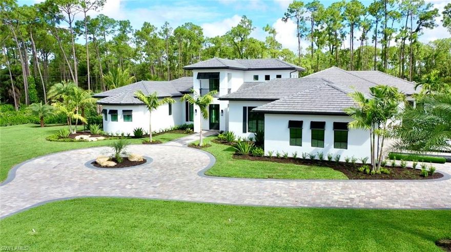 H.16343 - Fall in love with this brand new, custom home located in Livingston Woods on a perfectly square, 2.5 acre corner lot with 2 entrances! Built by Cintron, this open floor plan boasts 5 bedroom + a study & 5.5 bath. Large kitchen w/double island featuring Luxury Series Quartz Countertops from Cambria & custom wood cabinets throughout. All Viking appliances with 2 dishwashers, an ice maker in bar area + don’t miss the wine room and hardwood engineered white oak flooring. No detail has been overlooked; enjoy 2 washers & 2 dryers with custom built in hamper, central vacuum system, security system, lighting & interactive home automation system and stereo system surround sound. Outdoors enjoy the breathtaking, custom courtyard w/water feature and exotic trees plus lush, mature landscaping that offers plenty of privacy. Custom outdoor kitchen & 1,200sqft covered lanai w/resort style pool and fire pit are ideal for entertaining family and friends. Also noteworthy is the 3 1/2 car garage with custom designed epoxy marble floors. This residence spans 6,050sqft of living space and 8,500 ttl sqft and is completely fenced in with custom gates. Truly a one of a kind property in paradise.