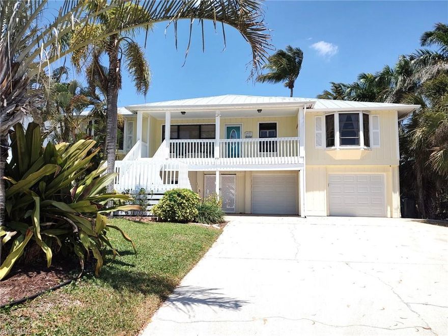 This stylish 'Old Florida' waterfront home offers so much more than meets the eye! The view of the 100’ Wide Canal is sensational from the lengthy, screened Lanai, which also overlooks the Lap Pool and 2 Docks! Total finished sq. ft. is 2,498 sq. ft. Upstairs under the vaulted ceiling is 1,546 sq. ft. with a 3-bedroom split plan. The lower level hosts another 852 sq. ft of finished space that is considered uninsured area. The spacious 2-car garage also has a workshop. The residence's extended drive allows parking for your various vehicles without limit. The 75 ft. wide riprap seawall supports the fishing dock and docks where you can hop on your boat or jet ski and be in the Gulf in 20 minutes! Complete with a metal roof the home is in great condition and the elevated lot helps keep the living quarters high and dry should the need arise. See it now and start 'LIVING YOUR DREAM' today!
