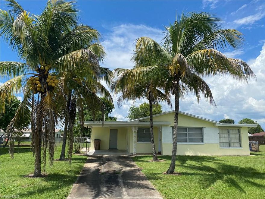 BACK ON THE MARKET! APPRAISED FOR $140K, APPRAISAL ATTACHED TO MLS.  BUYER FINANCING FELL THROUGH.  Beautiful jewel box of a home on city water and sewer in downtown Lehigh Acres.  New kitchen with custom cabinets, granite counter tops, and 4 piece stainless appliances package. New roof 2018.  Terrazzo floors freshly polished, new carpet in bedrooms, new bathroom vanities, toilets, and flooring.  Fresh paint in side and out!  Master bedroom has walk in shower.  New water heater.  Large Florida room with sliders and a/c unit.  Large fenced backyard for regular and fur babies to play in.  Separate utility room w/ washer and dryer hook ups and plenty of room for storage. Attached carport to keep you out of the rain unloading groceries.  The driveway is even lined with mature coconut palms for that tropical experience.