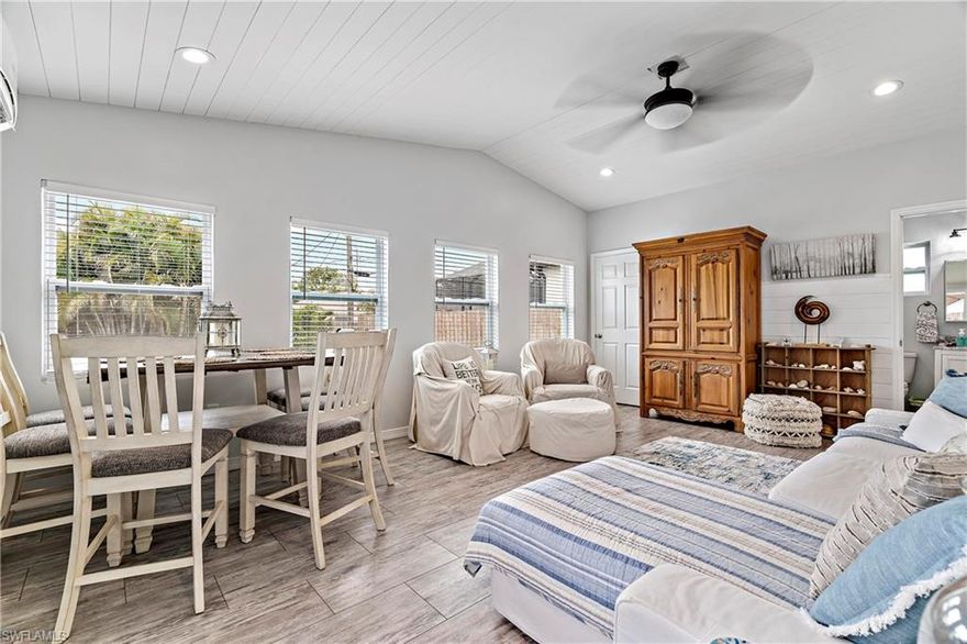 Renovated Tropical bungalow, Priced to Sale, Nice Rental Ready income producing property with so much potential! Nestled in Naples Park community perfectly situated near shopping, dining, and beautiful white sandy beaches. The newly renovated kitchen features new appliances, quartz countertops, and is fully supplied with dishes, bakeware, silverware, pots and pans, Keurig and Mr Coffee coffee makers, microwave, and many other small kitchen appliances. Both bathrooms are nicely renovated with marble countertops and new fixtures; enjoy a relaxing soak in the oversized jacuzzi tub! The new addition open living room area and bathroom gives the property the additional space to host even more guest and other options to design your lifestyle needs. 
Beautiful outdoor area, landscaped backyard, with plenty of seating, and featuring a covered pergola with an outdoor sectional and fire table.The space is illuminated with automatic Edison lights and the landscape lighting. New Impact windows thought out the property and much more..