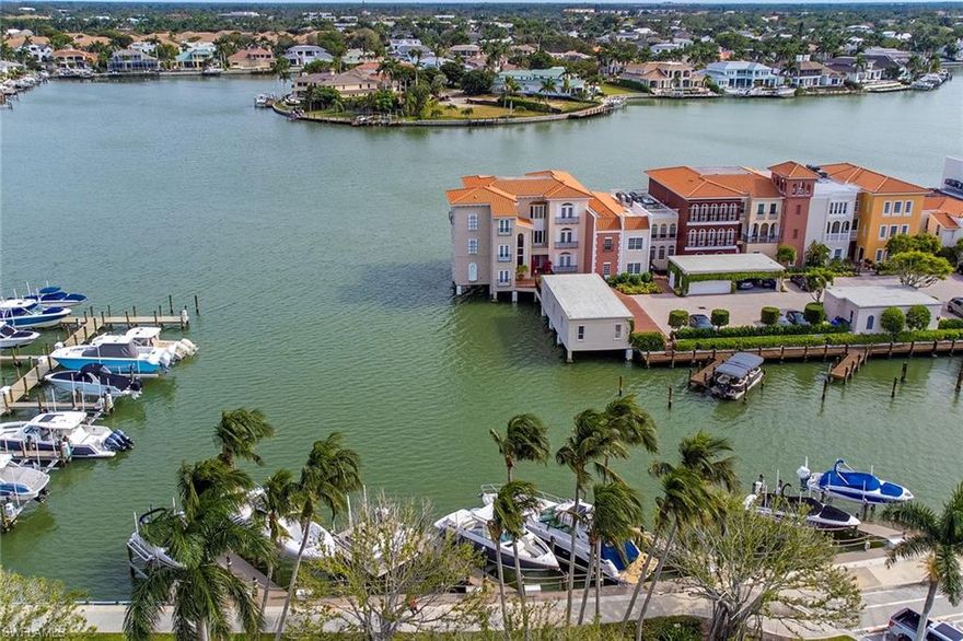 Ideally located just south of Venetian Village, Boat Slip #5 of Venetian Bay Yacht Club enjoys great slip location, pull in nose to nose with your boat! This dock accommodates up to a 40-foot boat. A 16,000 lb. capacity lift was installed in 2019 with all new motors in 2022. An aluminum boarding platform was also added for easy on/off for passengers. The south part of Venetian Bay Yacht Club was recently reconstructed with all new components and synthetic decking. Low maintenance fees of $2,200 per year include electricity and water usage. Refuel at the Park Shore Marina on the north side of Venetian Village on the weekends. Gulf of Mexico access through Doctors Pass is just 1.5 miles south. Buyer to confirm all dimensions, depths and bridge clearance.