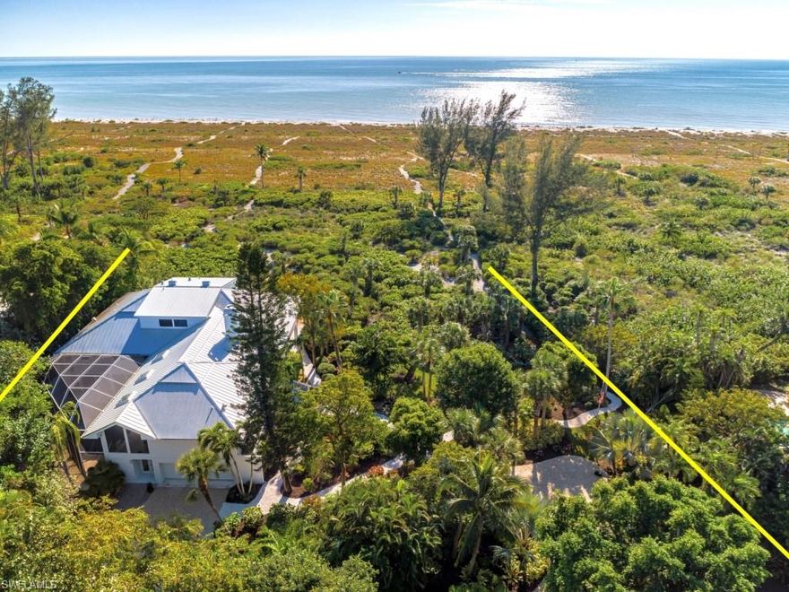 Located on the beach on two large lots w/nearly 4 acres of lush landscaped privacy in private & exclusive Gulf Ridge Subdivision! Enjoy meticulous grounds w/walking paths, tropical foliage, relaxing private pool area & two private beach paths. The home is incredibly maintained, you will love the open feel w/high ceiling yet it’s cozy, casual & elegant! The home features a large kitchen, separate dining, enclosed protected lanai area off the main room, library w/beautiful wood shelving/built ins, master suite on the main level w/views of the beach & a generous upstairs BR w/its own private balcony overlooking the Gulf. A true 4 BR 4 BA home that enjoys a concrete piling system/slab, impact windows & doors, elevator, newer metal roof, 2 car garage, lots of lower level lounging areas, bonus areas, community pool & tennis. This is a fantastic upscale beach house that's perfect for an executive seeking peace and quiet to get away from it all or a family seeking an incredible Island escape!