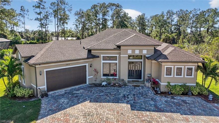 STUNNING GOLDEN GATE ESTATES HOME! THIS NEWER BUILT (2021) private, electric gate 3 BEDROOM, DEN, 3 BATH, POOL-SPA HOME HAS OVER $300,000+/- IN BUILDER/OWNER UPGRADES YOU WON'T SEE IN OTHER HOMES. 2.5 ACRES, completely cleared and fenced, it has a rare Estates property benefit, that goes through from Jung to 16th, so it is perfect for businesses and trades for dual access and storage.  BIG OPEN FLOOR PLAN, 12' SOARING CEILINGS WITH ALL "WOOD PLANK" CERAMIC TILE THROUGHOUT THE ENTIRE HOME. "CHEFS" Kitchen Custom Wood Cabinets, High End LC Stainless Steel Appliances, Level 5 Granite Tops, Center Island Work & Family Gathering Station, Pantry and additionally a "BUTLERS PANTRY FOR  GUEST ENTERTAINING. THERE ARE 2 MASTER BEDROOMS: First Master Bedroom has HIS & HERS walk-in closets, dual granite vanities, sunken Roman Tub, and floor-to-ceiling glass & tile walk-in shower, second carries the same tone throughout. POOL-SPA IS CUSTOM BUILT WITH LARGE  PAVER DECK AND A BEAUTIFUL COVERED LANAI AREA WIT A REAL "SOUTH BEACH" VIBE. This home is ideal for families that run their business from home or men in the trades with the property's double entry. HOME COMES WITH A ONE-YEAR HOME WARRANTY FOR TOTAL BUYER COMFORT.