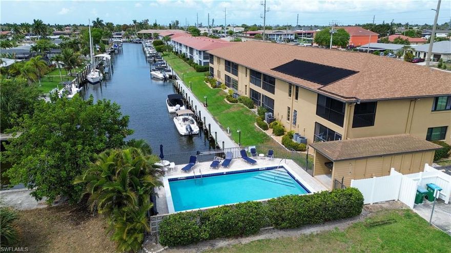 Gulf access corner condo with southern exposure, pool and canal views, boat docks, and covered parking in the desirable Monte Carlo 55+ waterfront community. Offering the relaxed coastal lifestyle Southwest Florida is known for. This beautifully positioned corner residence enjoys added privacy along with peaceful views of the pool and the direct Sailboat Gulf access canal. This well maintained 2 bedroom, 2 bath is ready for immediate enjoyment. The spacious layout includes a comfortable living and dining area, an eat-in kitchen with breakfast bar, and a desirable southern exposure that fills the home with natural light. Step out onto the screened lanai, the perfect place to enjoy your morning coffee while overlooking the water. The primary suite features a walk-in closet, while the in-unit laundry room includes a washer and dryer for added convenience. Boaters will appreciate the direct sailboat Gulf access with first-come, first-serve boat docks located just outside the building, making it easy to spend the day on the water. Additional features include covered parking and private storage. Ideally located along Cape Coral Parkway, you are just minutes from waterfront dining, shopping, medical facilities, and entertainment. World-famous destinations such as Sanibel Island, Captiva Island, and Fort Myers Beach are a short drive away, along with convenient access to Southwest Florida International Airport. If you’ve been searching for easy waterfront living in a welcoming 55+ community, this is a wonderful opportunity to enjoy the Florida lifestyle you deserve.