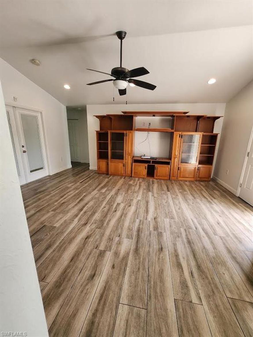 Beautiful 3/2 home, tile throughout home. Laundry room with storage. AG 2.5 acres all fenced in. Circular driveway on a quiet county road. A must see.