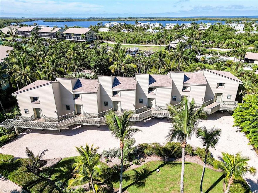 BOATERS PARADISE FOUND!!! Deep-water BOAT SLIP included! This furnished 2BR/2.5BA condo at Bocilla Island Club offers beautiful Charlotte Harbor views and tasteful updates throughout. The open living and dining area flows to a vaulted screened lanai, ideal for enjoying sunsets and breezes. Upstairs, both bedrooms feature private baths, while the main level provides a convenient half bath, kitchen, dining, and family room. Impact windows, sliders, and doors provide peace of mind. Community amenities include two heated pools, tennis/pickleball courts, shuffleboard, walking paths with bay views, and a private fishing pier. The on-site marina offers a boat ramp, fuel, and bait, with quick boating access to barrier islands and fishing waters. New roofs were installed in 2023, and flood insurance is included in HOA fees. Additional features: two covered parking spaces under the unit (one large enough for a boat or trailer), plus a large private storage room. This is a boater's dream come true as this property is located near several marinas such as Bocilla Marina, Four Winds Marina, Jug Creek Marina and just minutes by boat to Boca Grande and Captiva Pass as well as local dining nearby. Rentals permitted with a 30-day minimum, up to 12 times per year. Sold turnkey with minimal exclusions. Start living the salt life today!