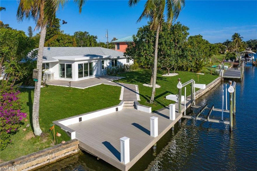 AMAZING SUNSET VIEWS FROM THIS BOATERS PARADISE REDESIGNED AND TOTALLY REBUILT 4 BR 3 BATH WITH DEN LOCATED ON DIRECT ACCESS CANAL OFF BIMINI BASIN IN THE YACHT CLUB AREA. 14 X 28 POOL TO BE INSTALLED . MINUTES TO RIVER AND ENTERTAINMENT AREAS. CUSTOM ALL WOOD CABINETS THROUGHOUT, QUARTZ COUNTER TOP WITH WATERFALL EDGE IN KITCHEN, NEW ROOF, IMPACT DOORS AND WINDOWS, ALL NEW PLUMBING, ELECTRIC, NEW HVAC UNIT, ICYNENE SPRAY FOAM INSULATION, NEW STAINLESS STEEL APPLIANCES WITH MICROWAVE DRAWER, HOOD, STEAM DRYER AND FRONT LOAD WASHER, LIFETIME WARRANTY MOEN FIXTURES THROUGHOUT, CHEF SERIES 16 GAUGE STAINLESS SINGLE BOWL KITCHEN SINK, CUSTOM CLOSETS THROUGHOUT, CUSTOM BUILT MIRRORS IN BATHROOMS, FRAMELESS SHOWER DOORS.  NEW 200 AMP ELECTRICAL SERVICE AND 100 AMP SQUARE D EXTERIOR PANEL FOR DOCK SERVICE, LANDSCAPE LIGHTING, FUTURE POOL SERVICE, OUTDOOR KITCHEN WITH ALFRESCO GAS GRILL, PORCELAIN PAVER WALKWAY, LANAI AND DRIVEWAY, NEW ZOYSIA SOD AND LANDSCAPING. MATURE MANGO AND AVOCADO TREES. NEW COMPOSITE DOCK.  INCLUDES BOAT LIFT. COMES WITH BUILDERS ONE YEAR WARRANTY.  OWNER FINANCING AVAILABLE. 14 X 28 POOL TO BE INSTALLED