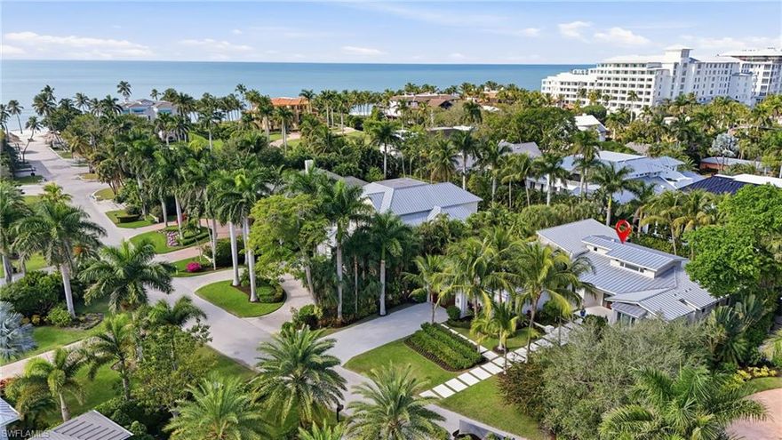 Only 700 feet to the beach on a quiet street just moments from the brand-new Naples Beach Club Four Seasons Resort, this custom single story home blends timeless Naples elegance with modern luxury. Built in 2017 and impeccably maintained by its original owner, it features a 3-car garage, newly renovated chef’s kitchen with Sub Zero and Wolf appliances, and a private butler’s pantry.
Smart home integrations include Savant technology, Lutron lighting, automated storm protection, generator, and dual tankless water heaters. Legno Bastone oak flooring, custom cabinetry, and refined millwork create a warm coastal aesthetic highlighted by abundant natural light.
The primary suite provides a serene retreat with its own morning bar and direct access to the pool and spa. Outdoors, enjoy a lap pool, spa, beach shower, and a fully equipped summer kitchen ideal for entertaining. 
Situated on a discreet private street in one of Naples’ most desirable beachside locations, this is an exceptional opportunity for buyers seeking the best in coastal luxury living without going vertical or requiring an elevator. 
The thoughtful layout exceeds expectations. A private tour is the only way to truly appreciate the volume and flow of the living spaces.
