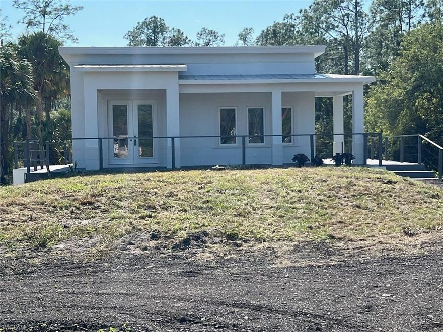 Remodeling is almost complete, just few more touch ups and work will be done. The height of the house offers you a majestic property that is imposed from the street and from a distance. Quiet neighborhood, plenty room for truck access to backyard, parking and storage. 1500 sq ft under AC and 1200 sq ft permitted detach garage. Lot of luminosity and light, title throughout, stainless steel appliances with new white shakers kitchen cabinets and quartz counter tops, fresh paint inside and out, modern design and majestic entrance porch, large concrete deck for parties and multi-use, huge screen lanai, perfect to enjoy the tranquility of the patio having a coffee and looking at the vegetation and enjoying the singing of the birds