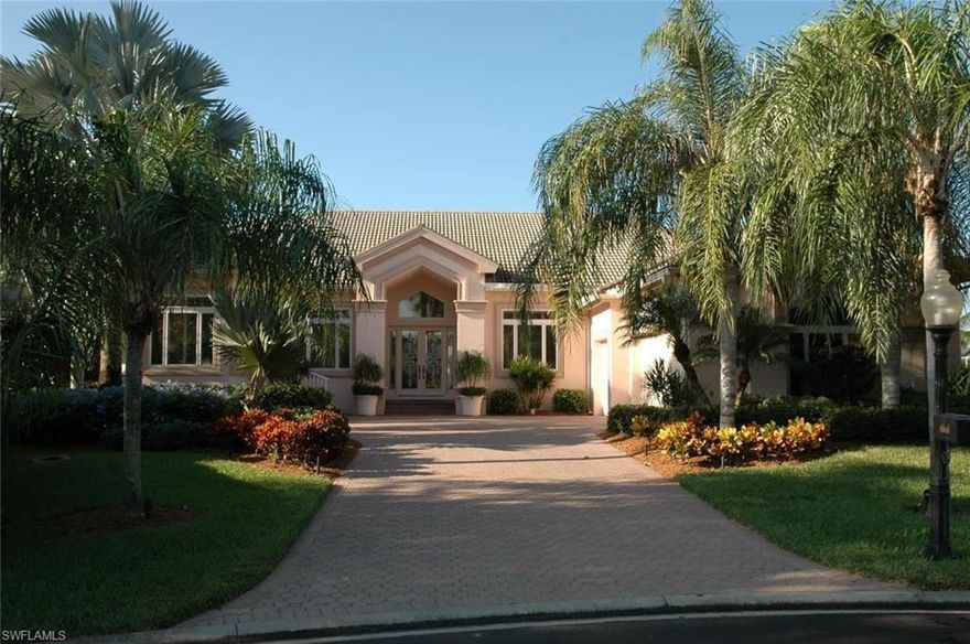 Spectacular lake lot with about 200' of panoramic frontage, huge paverstone pool deck with infinity edge pool, open kitchen light wood cabinetry, walk-in pantry, serving station w/bar, all 3 bedrooms are Ensuite, plus double dens, 3 car garage.