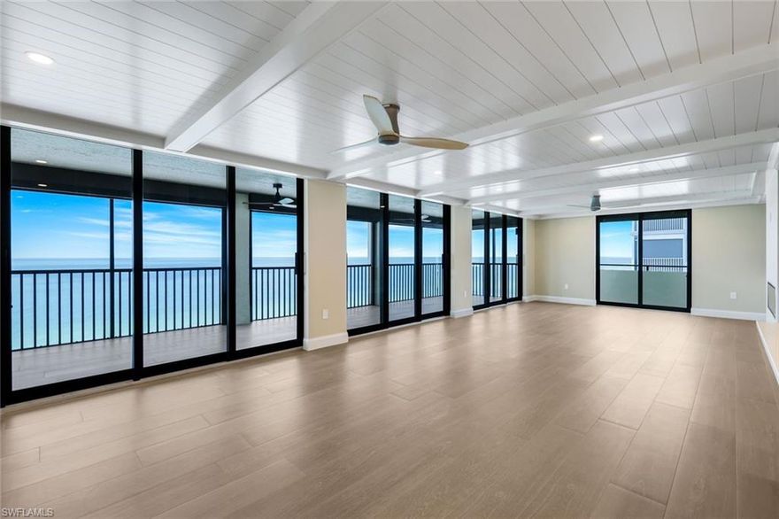Stunning Gulf-Front Penthouse | 3 Beds + 3.5 Baths | Boat Dock | Fully Renovated. Experience coastal luxury at its finest in this completely renovated 3-bedroom, 3.5-bathroom penthouse in the exclusive Villas of Vanderbilt Beach. Offering unobstructed panoramic Gulf views, this top-floor condo is a rare find. Step into an open-concept floor plan with floor-to-ceiling 8' Marvin impact sliding glass doors and windows, filling the space with natural light and showcasing spectacular sunsets. The interior features brand-new Riva Wood porcelain tile, a chef-inspired Thermador kitchen, and a 92-bottle wine cooler, all centered around a sleek white quartz island. Each bedroom includes a private en-suite bath, and the unit also features a stylish powder room for guests. Enjoy seamless indoor-outdoor living on the spacious lanai, perfect for entertaining. Additional highlights: Deeded 25-ft private corner boat dock with direct Gulf access, two premium garage parking spaces, brand-new electric hurricane shutters, new plumbing, electrical, HVAC, and water heater. Located between the Ritz-Carlton and La Playa Resort, you are minutes from Waterside Shops, Mercato, fine dining, and upscale nightlife. Villas of Vanderbilt Beach is a boutique, pet-friendly 7-story building with only 26 units, a newly updated lobby and elevators, and a brand-new pool and sun deck coming in 2025 (all assessments paid). Don’t miss this one-of-a-kind opportunity to own one of the best views on the Gulf.