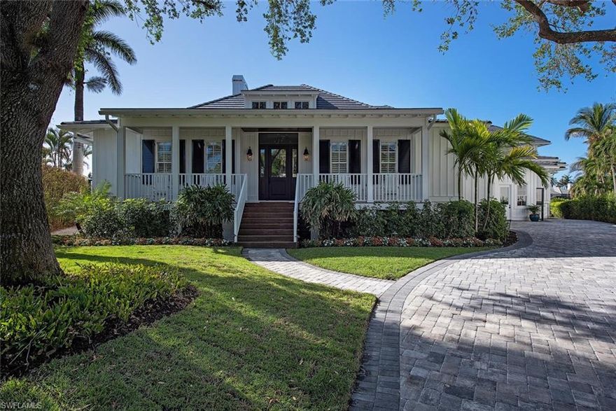 Boater’s paradise meets luxury retreat in Aqualane Shores. Remodeled in 2022 with open water views over Naples Bay and ideal southern exposure. This Old Florida style home boasts 210’ on water. There is a 40’ floating dock, a 90’ stationary Trex dock, and Tiki bar. This luxury home offers 5 bedrooms with ensuite baths, office, large utility room with “mom’s” office, huge pantry, multiple storage areas, 2 car garage with lift for 3rd vehicle, and airconditioned storage area. The kitchen is open to the family room and is equipped with Viking range, Sub-Zero fridge, built in Meile coffee maker, and brand new cabinets. Quality exudes from the rich 5” reclaimed heart pine floors, solid custom Brazilian wood doors, two fireplaces, and updated Sonos and A/V system. Lounge on the oversized lanai with roll down screens and enjoy views of Naples Bay. This property is in walking distance to 3rd Street shops, restaurants, and the beach. Impeccably finished with custom high-end furnishings that complete this oasis and are negotiable. This is waterfront living at its best in Naples.