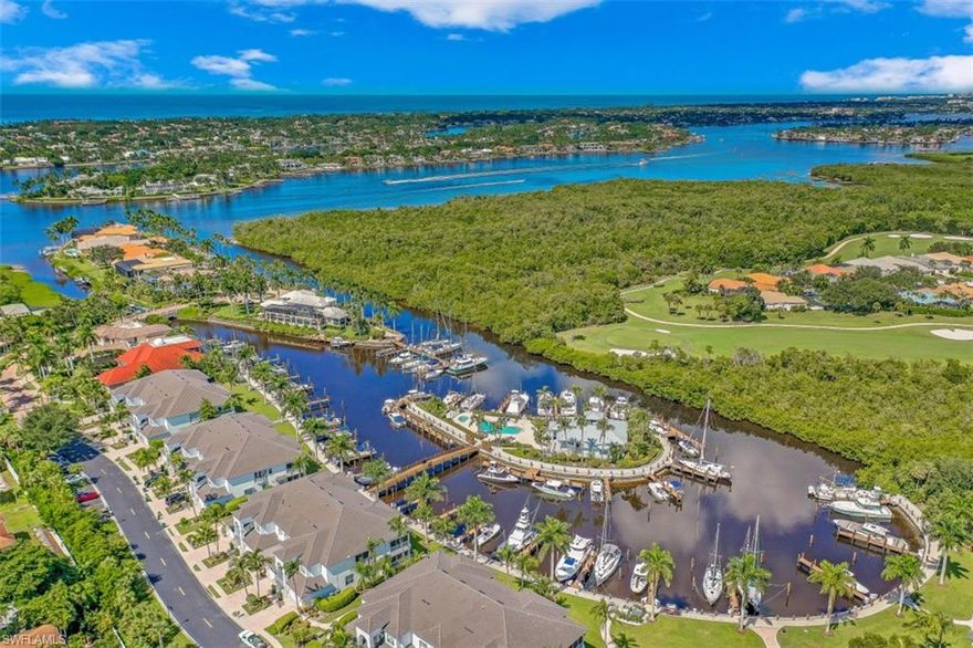 H3704 -  This magnificent Estate home INCLUDES a 50 foot deeded Boat Slip, located steps away in the Southpointe Marina w/ FT Harbormaster! With 6400+ total sq ft this home is sited on a .48 acre waterfront lot w/ Private Boat Dock w/Boat Lift behind the home as well. The Island at Southpointe is an elite enclave of only Ten Waterfront Estates on Naples Bay. Located in the exclusive Windstar on Naples Bay, Naples’ Only gated Golf Community with a Private deep-water Marina. This home exudes a welcoming and comfortable elegance that encompasses the Naples lifestyle. Perfect for entertaining, the beautifully appointed Chef's kitchen is clad with premium JennAir appliances and Custom Cabinetry. The resort-style backyard showcases a pool/spa and massive screened Lanai with numerous lounge and dining areas. Boasting two Owner’s suites, one off the main level and another upstairs, each with impeccable views of the Preserve and Bay, walk-in closet, private balcony/deck, and gorgeous spa-like bath with dual sinks, shower and separate soaking tub. A rare opportunity to own such a Sophisticated Coastal Estate