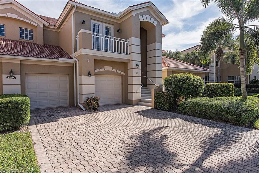 This coach home lives like a single-family home with its spacious bedrooms and living area. Enjoy sweeping lake and golf course views from this awesome second floor unit. This home shows like a model with a private elevator. The living areas and master bedroom and den/office all have crown molding. Other upgrades include, central vac., phantom screen in guest bedroom off the outside patio, hurricane shutters on the lanai, surround sound in living room, kitchen, lanai, master bedroom and den, and California closets. The kitchen was renovated with granite, back splash and new appliances in 2015, however the refrigerator was replaced in 2006. A/C is four years new. The ever popular community of Mont Claire is located in Pelican Marsh in north Naples which offers wonderful amenities.