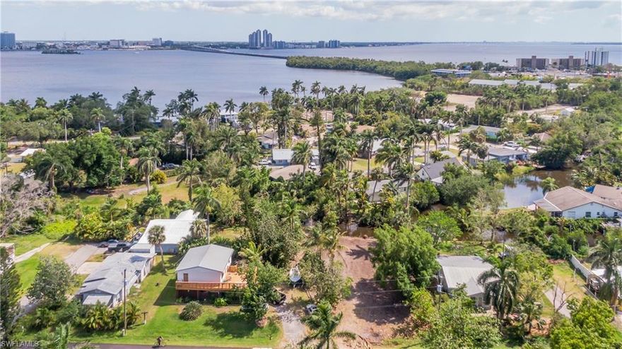 67 Oak Street offers a rare opportunity to build in a quiet, conveniently located neighborhood just across the river from downtown Fort Myers. Situated at the end of a serene canal off the Caloosahatchee River, this cleared and build-ready lot provides the perfect setting for your future home. Enjoy the peaceful charm of a community known for its iconic roaming peacocks while staying just minutes from the dining, nightlife, and energy of the downtown riverfront district. With access to water and easy connectivity to both city life and nature, this property seamlessly blends tranquility with convenience.