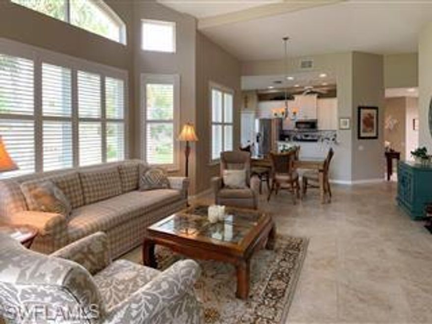 Beautiful 2nd floor "Sheffield" overlooking the lake and preserve located in the golf village. Lovely end unit features plantation shutters, newer ceramic tile in the living, hallway and lanai, vaulted ceilings, private entrance and a 2012 A/C with 2019 new thermostat. Kitchen has 2019 Core Tec flooring, 2021 New microwave and dishwasher, upgraded granite counters and refaced kitchen cabinets. Laundry area has newer 2019 LG washer and dryer.
Tiled enclosed lanai features acrylic sliders, no see um screens, new sprinkler head and roll up sun shades. Master and guest baths have newer decorative lights, and newer hardware. Golf membership included, annual fees apply. Lexington Country Club is a 24 hour gated community and located within minutes of the beaches and shopping!