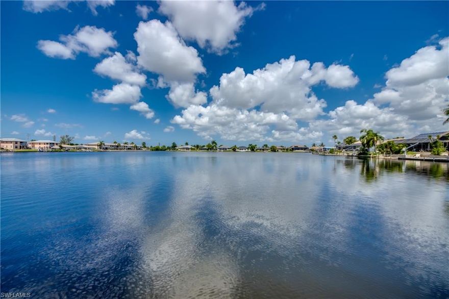 Discover the ultimate Florida lifestyle with this stunning gulf access condo, offering a perfect blend of luxury and convenience! Bayshore Condo is centrally located in Cape Coral and within walking distance to Publix, bus stops, restaurants, and more. Nestled on Lake Louise, this condo offers unparalleled, wide water views and saltwater access to the Gulf of Mexico. The heart of this home is the spacious, updated kitchen featuring beautiful raised panel, soft-close wood cabinets, and upgraded granite countertops. Equipped with stainless steel appliances, this entertainment-sized kitchen is perfect for the serious chef or baker, providing ample counter and storage space, plus a matching desk in the foyer. This is one of the larger gulf access condos Cape Coral has to offer, boasting over 1,300 square feet. It includes two spacious bedrooms, with the master bedroom overlooking the lake. The master bedroom also has access to a screened lanai, perfect for enjoying a glass of wine as you enjoy the breathtaking sunsets over the lake. From this vantage point, you can watch dolphins, manatee, and birds play in the water. The unit also features an inside laundry room with a washer, dryer, and plenty of storage and workspace. Replumbed in 2018, it features a tankless water heater and HVAC installed in 2019. The unit is equipped with electric roll-down hurricane shutters on the front guest bedroom and great room, plus manual roll down shutters on the lanai for added peace of mind. An extra storage unit is located by the carports for your bikes and beach toys. Enjoy the convenience of undercover parking right outside your unit and ample guest parking near the community pool. Residents also have access to common community boat docks at no extra charge. Year-round enjoyment awaits at the heated community pool, complete with restrooms and a BBQ grill. The building had a new roof installed in 2018. The affordable HOA fees of $490 per month include water, sewer, insurance, pest control, and professional management. This rent-friendly community does not allow pets. No flooding in hurricane Ian. Cape Coral with its 400 miles of canals is renowned for its beautiful waterfront living, abundant outdoor activities, excellent dining options, and a strong sense of community, making it an ideal place to call home. Plus consistently rated best place to retire, best place to work and safest city for its size! Less than 3 miles to Cape Coral’s beach, 12 miles to Ft Myers Beach and 14 miles to Sanibel. Live within hours of Disney, the Florida Keys and Tampa at an affordable price! Come discover how beautiful and affordable lake living can be at Bayshore Condo in lovely southwest Florida!