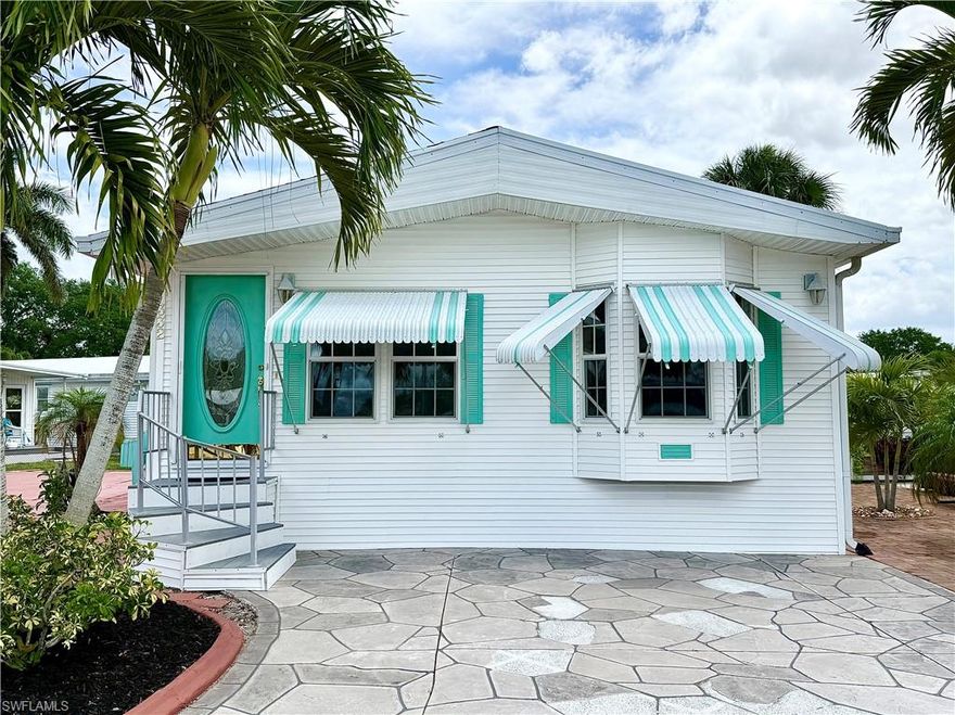 Lovely 2Br/2Ba with large LR & eat-in kitchen area located within the Imperial Wilderness Condominium Association of Naples, FL— This home features LAND that YOU OWN! Inside you’ll appreciate drywall, higher ceilings, laminate & tile flooring, and a modest rear water view. Since the property faces west, relaxing sunset views are visible from the front windows. The kitchen contains ample counter space, a dishwasher, disposal, and a serving bar adjacent to the dining area. The main bedroom has 2 closets and built-in drawers. The second bedroom is quaint (currently arranged as a craft room/study/laundry room) with built-in cabinets, washer/dryer, desk, and counter space. An added unique perk of this home is the attic storage area with dropdown ladder (located on the ceiling of the second BR). IWCA is a gated 55+ community located minutes from restaurants and stores. Plus, I75 is easily accessible, and it’s a 45-minute drive to Ft. Myers. Also, beaches are close: 11 miles to the Naples beaches and 8 miles to Marco Island beaches. On top of everything, the community was never flooded and has not been affected by any recent hurricanes. This home is a fantastic option for seasonal, full-time, or rental purposes. The HOA fee of $898. per quarter covers water, lawn care, basic cable, trash/recycling, and community amenities. There are numerous community amenities: 2 pools with spas, a nature trail, pickleball, tennis, horseshoes, bocce, pétanque, memorial garden trail, the ability to drive an electric golf cart within the park, and 2 dog parks (1 pet– 40lb. maximum weight). IWCA offers an extremely active social events calendar (daily events).