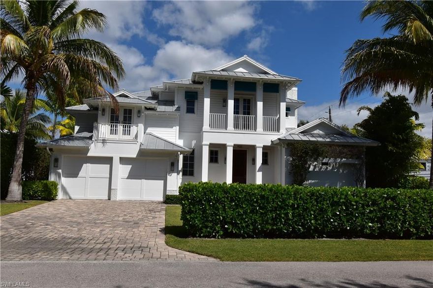 Located in the heart of Olde Naples, this 2015 RG Designed home is just steps away from beautiful Gulf beaches,  world class shopping and dining on Fifth Ave S & Third St. South.  10 Ft French doors & 3 balconies on the second floor, bathe this open floor plan coastal contemporary home with plenty of natural light.  Entertain friends & family in the bright and airy gourmet kitchen featuring Wolf Gas Range and huge white marble island.  Or take the party outside to enjoy the travertine paved lanai with heated pool with spa and outdoor pool bath. Spacious ground floor owners retreat features luxurious oversized shower w/ body jets, rain head, regular head & hand held unit, 2 vanities, 2 water closets and 2 custom walk in closets. The 2nd floor offers 3 bedrooms each with en suite bath and walk-in closets & additional bonus room. Light oak floor throughout, Anderson impact windows and doors.  500 gallon LP gas tank, Lutron LED lighting, Sonos built-in sound system, elevator ready and so much more. 7 minute walk to 3rd Street South. 9 minute walk to 5th Avenue South.  9 minute walk to Naples Beach and 14 minute walk to the famous Naples Pier.  Enjoy the Naples lifestyle at its finest.