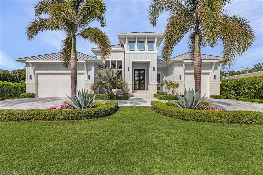 Step into refined coastal elegance in this exceptional residence by Borelli Construction, completed less than 3.5 years ago and located in the prestigious Park Shore neighborhood. This elegant home offers the best of Naples living—just moments from the private Park Shore Beach Park, as well as world-class shopping and dining at Venetian Village and Waterside Shops. Designed in a soothing coastal style, the home features four private bedroom suites plus a versatile office alcove with extensive built-in storage. High-end finishes rival those found in the newest luxury builds, including European white oak flooring throughout, designer lighting, and a chef’s kitchen with a hidden butler’s pantry for seamless entertaining. Soaring 10-foot tall sliders open the main living space to the covered lanai that is protected by electric screens and hurricane shutters. Mature foliage creates a private oasis around the 40-foot lap pool, sun shelf and spa. Whether you're enjoying quiet evenings or hosting guests, the seamless indoor-outdoor living is simply unmatched. Built with both beauty and durability in mind, the home is elevated to 11 feet in an AE10 zone, and includes a whole-house generator powered by a 1,000-gallon propane tank—providing peace of mind year-round. Modern comforts abound with Crestron home automation controlling built-in speakers, security cameras, hardwired electric shades, lighting, and pool systems—all in the home or remotely. This is more than a home; it’s a modern sanctuary in the heart of one of Naples' most sought-after communities and built by Naples' premier luxury builder.