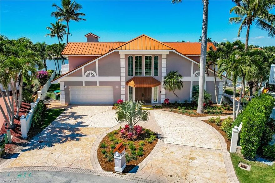 One of the few coveted waterfront properties on a large point lot offering expansive water views. Large 2 level home with 5 BR's & 7 full bathrooms total. Over 5k SF of living area. Boat dock with lift and 2 additional jet ski lifts. Home had Hurricane Milton damage on the 1st level and is ready for a re-build or can be torn down to make room for your custom dream home. 2nd level is in great condition and was not affected; offers a media room, loft with pool table, kitchenette, 2 BR's and 3 full bathrooms. Roof-top deck catches the pristine Gulf waters of Vanderbilt Beach.