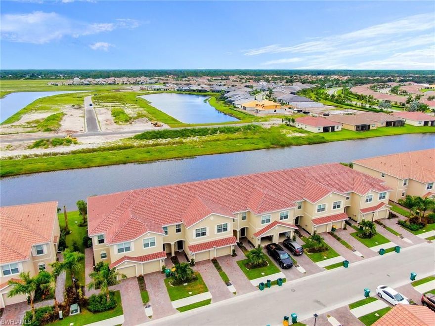 Prime Location!! Welcome to Orange Blossom Ranch Townhouses division , one of Naples Florida fastest growing  communities.  This wonderful two story townhome with expansive lake view is only 1 year old,  features nearly  1,900 Sq. Ft of living space, 3 large  Bedrooms,  2 Full  Bathrooms, 1 half bath, and 1  car garage. New kitchen, maple wood  cabinetry, new granite  countertops, new  stainless steel appliances, new light fixtures, new based boards, new crown molding, new light switches and outlets new door handles, new washer and dryer and much more. Spacious Master Bedroom, 2 large walk-in-closets, new tile flooring in all living areas and carpet in the second floor. Step out through the sliders from the great room to the screened lanai with spectacular lake views.  Orange Blossom has the most incredible lifestyle including 2 Resort Pools, 2 Spas, 2 Basketball, 2 Tennis, 2 Playgrounds, Splash Pad, Social Clubhouse, Fitness Center with Kids Play Area, Full Catering Kitchen & Bar, Sand Volleyball, Fishing Pier and more! Also desirable school district and less than 5 mins to Publix Supermarket, CVS, and the new Dunkin Donuts. New regional park being built just a few miles away!