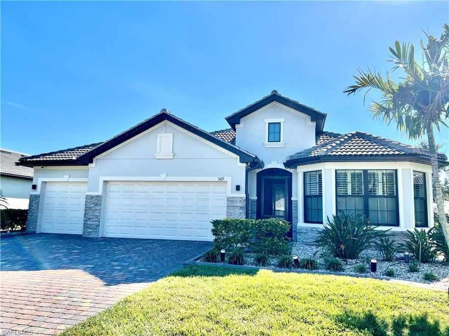 This home is the crown jewel of the Hampton Lakes neighborhood, sitting at the base of a large lake on a fenced oversized lot. The huge 3 car garage is custom with added space for storage. This home has been upgraded with with a large custom built, heated salt water pool and spa. the outdoor bar, dining area, 70" large screen smart TV,(conveys)  LED lights and built in speakers for entertaining makes this property incredibly unique.  Outdoor living area boasts a custom panoramic screen enclosure for maximum views. Gorgeous setting for morning coffee and watching the abundant wildlife at sunset. Tile and luxury vinyl floors in bedrooms and closets. This home features large master bedroom with dual sinks, shower, water closet and very spacious walk in closet.   Take a walk or golf cart ride to the  club house to enjoy the weight room or beach style pool, pickel ball courts, playground and large grass areas to play with your kids or dogs. Furniture and golf cart are negotable.