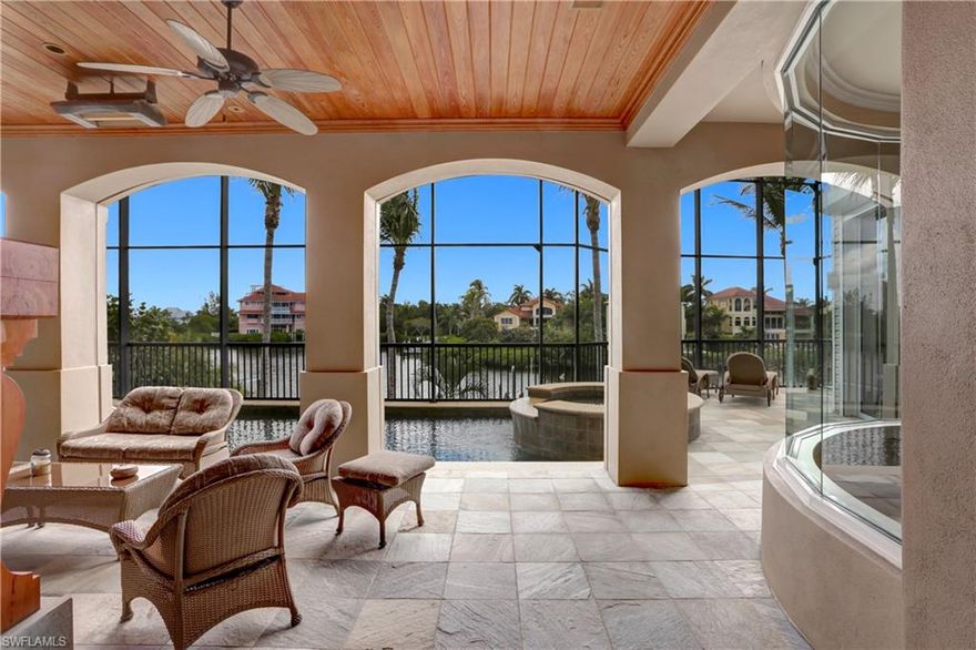 Wow! It's a BEAUTIFUL home with an IN-LAW SUITE and SIX CAR GARAGE within walking distance of the BEACH! ENTERTAIN family and friends in casual elegance, be the BOATER and FISHER you've always wanted to be, take a SHORT WALK to see the DOLPHINS off BAREFOOT BEACH and then sleep securely at night in your DOUBLE-GATED community. You've earned this Florida Lifestyle! It's waiting for you in your Dream Home on the Bay! This beautiful 4 BR plus DEN residence plus in-law suite has all you've ever wanted in a Florida home: GULF ACCESS with no bridges, 2 DOCKS and LIFTS, gorgeous swimming POOL, GOURMET KITCHEN with Sub-Zero, Wolf and Miele appliances, Imported NEFF Cabinetry, WATERFRONT formal dining room, FUN oversized family room with fabulous professional fully-equipped walk-in barroom/pub with wine cooler, double refrigerators, ice maker, dishwasher and counter-seating for 4. You'll love the SURROUND SOUND and LUTRON Electronics System! If that's not enough, add IMPACT GLASS, electric recessed storm SHUTTERS, exterior painted in 2018, newer A/C systems, safe room, WORKSHOP, a SIX CAR GARAGE with AIR CONDITIONED MAN-CAVE or DANCE STUDIO and GENERATOR!