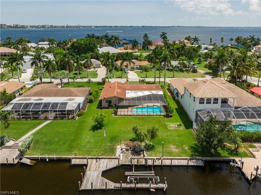 Iconic Dolphin Drive Cape Coral Waterfront!!!! Minutes to the mouth of the River and in walking distance to Cape Coral Yacht Club Beach and Boathouse Restaurant. EASY TO SHOW CALL TODAY1
