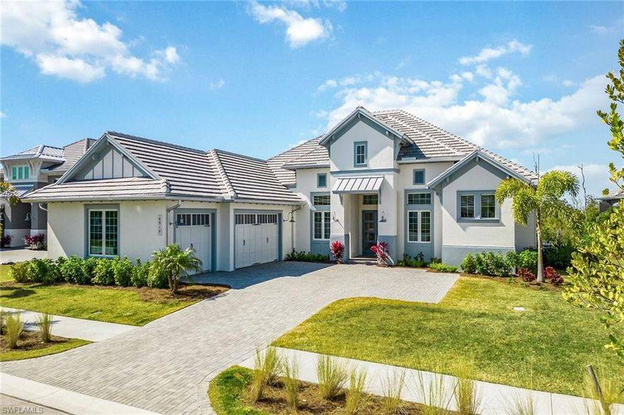 A newly built masterpiece on a quiet cul-de-sac street in the new exclusive gated community of the prestigious Isles of Collier Preserve. This exquisite property offers 3,578 square feet of sophisticated living space, comprising four bedrooms, a den and 4.5-baths. As you approach, the wide paver driveway gracefully leads you to a three-car garage with epoxy flooring, setting the stage for the home’s striking tile roof with metal accents, and impact-resistant doors and windows. The lush preserve and mangrove backdrop with southwestern views is ideally framed by an expansive picture window screen enclosure. This outdoor oasis features a gas-heated saltwater pool and spa, covered area with coffered ceiling, a built-in gas fireplace and an outdoor kitchen with gas grill, granite countertops, and a large center island for endless relaxation and entertainment while enjoying stunning sunsets. Inside, the awe-inspiring 14-foot ceilings, adorned with crown molding, smooth coat walls and ceilings, recessed lighting, open floor plan and in-ceiling speakers amplify the grandeur. The foyer welcomes with museum-style double glass doors, while the den with its tray ceiling and glass French doors offers a tranquil retreat. The living room with pocketing 10-foot sliders that join the inside with the outdoors, is accentuated by a stunning beamed ceiling with a designer chandelier, seamlessly flowing into the gourmet kitchen. Here, pristine shaker-style cabinets with underlighting, quartz countertops, Carrara marble backsplash, grand center island, walk-in pantry, and new KitchenAid appliances, including a five-burner gas cooktop, await culinary exploration, together with the breakfast area overlooking the pool. The formal dining room, with its coffered ceiling, basks in natural light, setting a picturesque scene for gatherings. The owner’s suite features pool views, tray volume ceiling, two walk-in closets, private lanai access, and a spa-like en-suite bath with dual sinks, framed mirrors and large walk-in shower. All three guest bedrooms are en suite with private baths for each room and on the opposite side of the home as the primary for privacy. Additional highlights include designer lighting, two Trane HVACs, instant hot water and a 500-gallon propane tank. Oversized laundry room with plenty of storage and counter space, and sink. Enjoy a new Stock-built Marigold floor plan home with high-quality features but without dealing with the hassles of the building and punch-out process. The Isles of Collier Preserve residents enjoy a gated entrance, resort-style and lap pools with cabanas, clubhouse, restaurant, fitness and wellness center, sauna, dining, dock with kayak launch, and courts for tennis, pickleball and bocce. Just 10 minutes from downtown Naples, this home is a gateway to a lifestyle of unparalleled luxury.