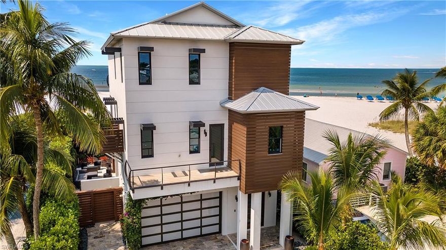 This Absolutely Stunning Beachfront oasis is one of a kind.  The professionally built and decorated modern interior and exterior of this home is an architectural masterpiece.
This amazing home is situated on the north end of the island with its serene unobstructed view of the Gulf of Mexico and surrounded by the sugar sand beach right to your doorstep.  Located within walking distance of lounges and restaurants that offers a location that is hard to beat. 
The home is a palace of luxury! From its built-in wine cooler, custom kitchen with 2 dishwashers, professional chef style gas range, custom LED lighting, Custom Hand railings, travertine driveway, Plush private landscaping and so much more.  
 The pool/spa has a large deck with privacy fence and mature landscaping on the sides of the home. 
Built in outdoor Kitchen with grill, sink and countertop area are great for entertaining with family and friends beachside.
This home has one of the best beachfront panoramic views throughout the island. You can view the north end of the pier to the south end of the island. This view is totally breath-taking.