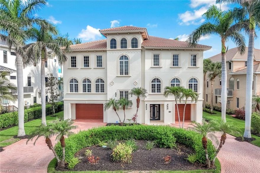 Welcome to a rare offering in the prestigious, guard-gated enclave of Barefoot Beach—where luxury living meets effortless coastal elegance. This charming waterfront estate in Southport captures the essence of refined Florida living, with direct Gulf access and timeless design details throughout. Step through a dramatic two-story grand foyer into light-filled interiors that blend coastal charm with modern sophistication. The chef’s kitchen is a culinary masterpiece, featuring premium appliances, custom cabinetry, and seamless flow into a spacious family room designed for elevated entertaining. Host elegant dinners in the formal dining room or enjoy casual gatherings in the expansive outdoor living area. Outdoors, indulge in resort-style living with a private pool and elevated spa, fully equipped outdoor kitchen with built-in BBQ, granite countertops, wine cooler, and big screen TV—all set against sweeping views of the bay. Your private boat dock with lift makes it easy to explore the Gulf in style. Inside, unwind in the formal living room by the fireplace, retreat to the reading room or executive office, or entertain in the game room designed for leisure and luxury. With four bedrooms and beautifully appointed baths, this home offers the perfect blend of comfort and privacy. Newly landscaped grounds enhance the home’s curb appeal, while the proximity to world-renowned Barefoot Beach ensures the ultimate in beachfront living. Ideally situated between Naples and Fort Myers, residents enjoy immediate access to fine dining, upscale shopping, and top-tier medical facilities. This is more than a home—it’s a lifestyle. Discover unparalleled waterfront elegance in one of Southwest Florida’s most exclusive communities.