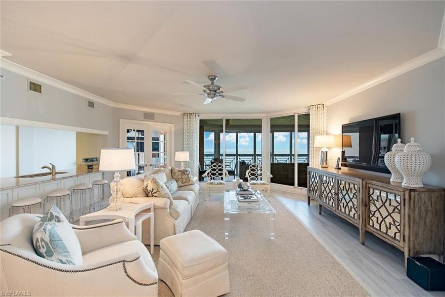 C1996 - Stunning Gulf & Bay views from this beautifully appointed luxury unit. Streamline and remastered with porcelain wood tile floors throughout, exquisite lighting, neutral wall tones, oversized  walk-in closets and laundry with utility sink. Perfect for entertaining with open concept living and dining. A chef's dream kitchen with breakfast bar, stainless steel appliance, and separate beverage cooler.  Stunning Bay sunrise views and sweeping sunset views overlooking the Gulf. Offered turnkey with high-end furnishing and personal putting green. The Brittany is an amenity-rich, pet-friendly building with exceptional concierge services. Located in Park Shore and within walking distance to the shops at Venetian Village.