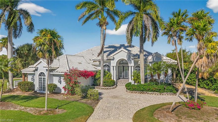On a premier golf course lot in The Dunes, this exquisite Sanibel Island home blends modern luxury with timeless Florida charm. Completely reimagined and rebuilt from the studs out, the residence features high-quality finishes, a redesigned open floor plan, and sweeping lake and fairway views from the main living areas. The bright, coastal-inspired interior includes wide-plank wood flooring, a designer kitchen with quartz waterfall countertops, custom cabinetry and top-tier appliances. The spacious primary suite serves as a private retreat with a spa-style bath featuring a freestanding soaking tub, walk-in shower and elegant finishes. Multiple living and dining spaces flow seamlessly toward the expansive screened lanai, where a resort-style pool, raised spa, stone-accented water feature, and outdoor kitchen create an ideal setting for entertaining or relaxing in the island breeze. Oversized sliders enhance the indoor-outdoor connection and fill the home with natural light. Additional highlights include updated guest suites, remodeled baths, lush tropical landscaping and a circular paver driveway framed by mature palms. In The Dunes Golf & Tennis Club community, this like-new home offers proximity to Sanibel’s world-famous beaches, bike paths and island amenities. A rare opportunity to enjoy a fully rebuilt, modern coastal residence in one of Sanibel’s desirable neighborhoods.