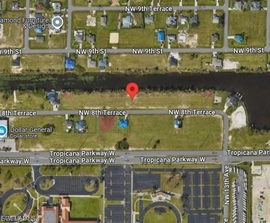 Prime development opportunity in Cape Coral. This commercial canal-front lot features 140’ of wide canal frontage with access to multiple lakes. All assessments are paid and utilities are already in place, making this property ready for development. Conveniently located near Chiquita Blvd, Pine Island Rd, Burnt Store Rd, and Tropicana Pkwy, with nearby schools, shopping, and everyday conveniences. Ideal for commercial development, builders, or investors, with potential residential rezoning subject to City of Cape Coral approval.