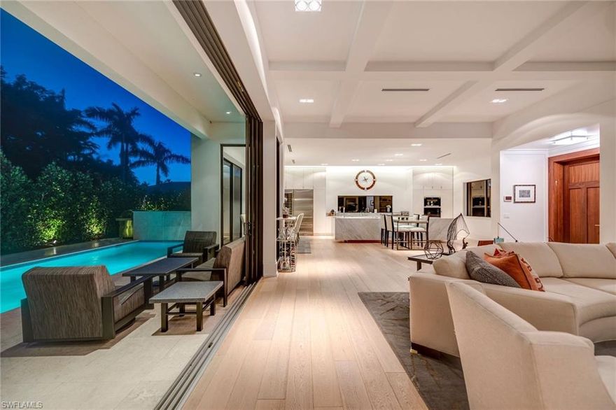 Urban Oasis located in the real heart of Olde Naples, this magnificent southern exposure 2-story property is ideally situated within 3-blocks of the beach. This stunning 3 Bedroom + Study or 4th first-floor bedroom, 4 bath residence revives the quintessential of Old Naples with a bold infusion of chic and casual elegance. High ceilings dominate the open floor plan bathed in abundant light. Thoughtfully appointed finishes include wide-plank flooring, Carrara marble, a fabulous chef’s kitchen, and white beamed ceiling treatments. The large gourmet kitchen features a 16 feet long island with waterfall Carrara marble countertops, Sub Zero fridge and Wolf appliances, double wine cooler, Cappuccino maker, cook-top with pop up vent and custom solid white wood shaker cabinets. Entertain with ease with an open concept floor plan that transitions seamlessly to stunning outdoor spaces. Embrace the Florida lifestyle from this home’s outdoor living area with pool and spa. This Old Naples home encompasses an unparalleled combination of location, quality, and finishes. A Mastery of Architecture & Craftsmanship. Agents see remarks.