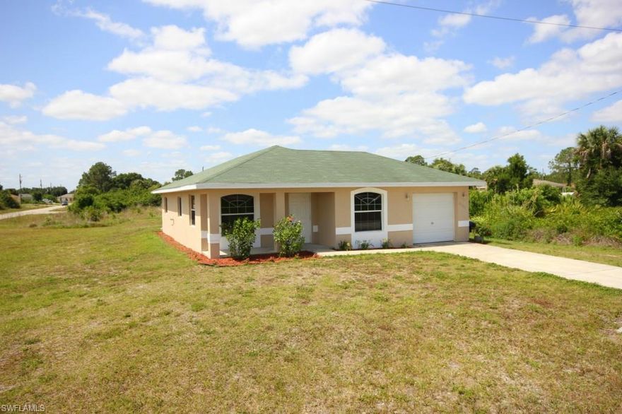 Check out this well kept 3/2/1 starter home with tons of upgrades and curb appeal! Built in 2007, this home has many features including; Ranch style porch in front, Fresh paint for exterior and interior, Staggered wood plank tile flooring, Wood cabinets and custom tile back-splash in kitchen, Large kitchen pantry, plenty of additional storage in a hallway walk in closet and an automatic sprinkler system. The master bedroom also features a large walk in closet as well as a new sink and fixtures in the master bath. Additional recent upgrades and maintenance include a 2 year old A.C. condenser unit, water softening equipment, garbage disposal and a 1 year old septic pump! Located on an over-sized corner lot with plenty of nice foliage and serene surroundings for entertaining. You have to see this one in person, you'll see the others don't quite compare, call today!