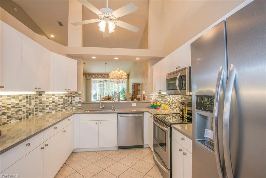 Seller says bring offers... motivated and ready to have a conversation. Nicely improved, new carpet, stainless appliances, quartz counter tops in kitchen, glass back splash and newly painted! Fabulous floor plan, separate den, guest bed and master suite on opposite ends for privacy. Over sized laundry and attached 2 car garage. Cathedral ceilings make this unit feel so much larger. End unit and private screened patio. one of the largest square feet in sapphire lakes...