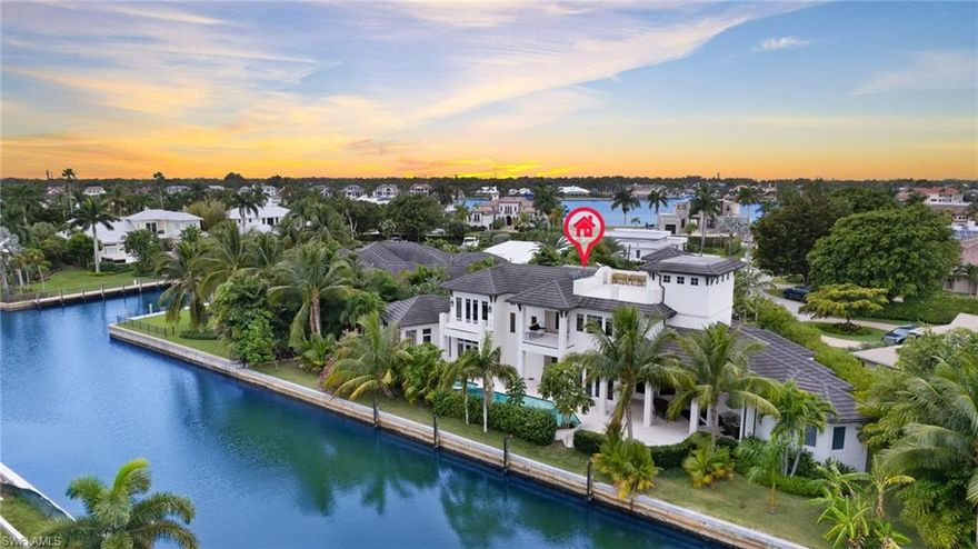 Welcome to 2275 Trout Court in prime Royal Harbor location.  Custom built by local renowned builder, Big Island Builders, this exquisite waterfront home seamlessly blends the indoor outdoor lifestyle. With over 5500 square feet of casually elegant living space this 4 Bedroom, 5 full plus 1 half bath home is sited on almost 200 feet of canal frontage and is truly a boater's dream with direct access to Naples Bay and the Gulf of Mexico.  Open-concept living area featuring a Chef's Eat-in Kitchen replete with Sub-Zero/Wolf appliances.  Living Room with 60" linear gas fireplace. Master suite on the first floor with pool access is a private sanctuary with views of the lush landscaping.  Spa-like En-suite Bath and dual walk-in closets.  Guest suite also with pool entry.  Ascend the dramatic stairwell to the second floor or access it via your 4-stop elevator.  A second Master Suite with private office plus sitting room with front and rear balconies plus additional guest suite.  Third floor rooftop entertaining deck boasts stunning 360 degree bay, canal and sunset views.  Saltwater pool, spa and sun shelf plus outdoor full bath.  Truly exceptional.