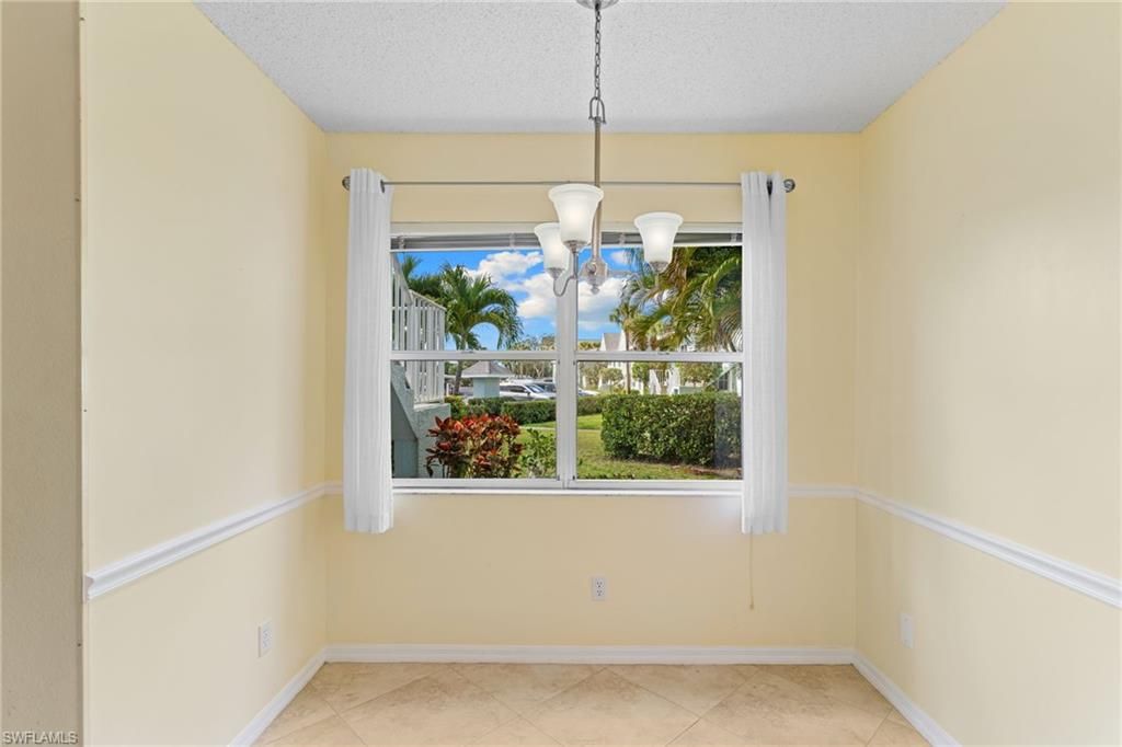 Photo of 177 Grand Oaks WAY #101, NAPLES, FL 34110 (MLS # 226009809)