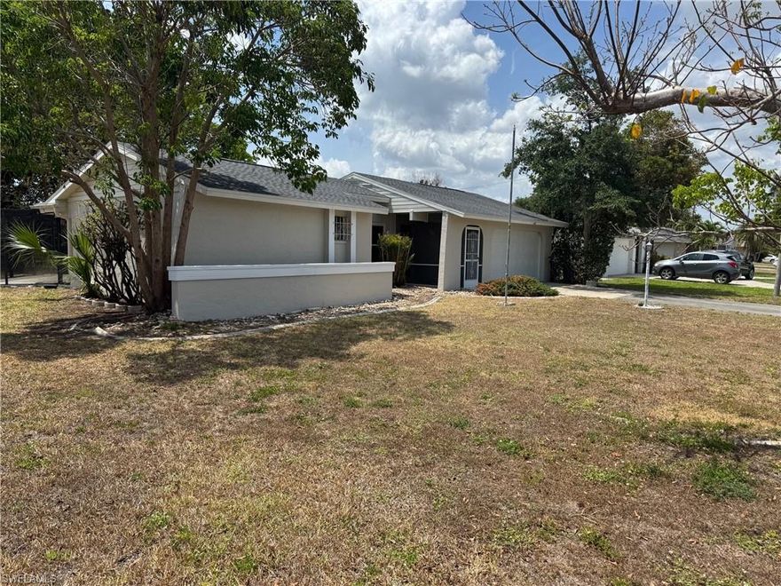 Charming starter, retirement, or great investment property on an oversized lot with plenty of shade trees and a tranquil hammock to immerse yourself with the outdoors. Welcome to 4126 SE 1st Ct.! This beautifully maintained home offers the ideal blend of comfort, space, and outdoor living. Nestled on an expansive oversized lot, this property provides ample room to grow, entertain, or simply enjoy a bit more breathing room and plenty of room for a sparkling pool. Step inside to find a cozy and functional layout, with two bedrooms, 2 full baths and an oversize two car garage!  This great room layout offers two corner sliders that open up and double the indoor-outdoor living space!  The heart of the home flows effortlessly to the backyard oasis—featuring a huge screened-in lanai and also an outdoor patio under the stars.  Whether you're starting your homeownership journey, looking for a seasonal escape, this home delivers. Enjoy privacy and plenty of room to personalize. Don't miss your chance to own a slice of paradise with the extra yard space in a quaint neighborhood!   Make your Move!