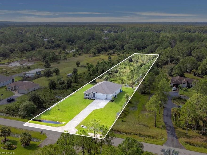 BRAND NEW! JUST BUILT! NO HOA! 1.49 ACRE PRIVATE LOT PARTIALLY WOODED! This gorgeous home was just completed and has never been lived in! 5 Bedrooms & 3 Full Bathrooms!  9'4" Volume Ceilings & Designer Ceramic Tile Flooring throughout the entire home! Tons of builder upgrades including the soft close Cabinets, Stainless Steel Appliances, Oversized Island & Solid Surface Countertops in the Gourmet Kitchen. Deluxe Master Bathroom Suite with Dual Vanity and Luxury Shower Ceiling Rainhead! Incredible Open Floorpan with Double Sliding Glass Doors, Concrete Block Construction with Stone Front Elevation, Lawn Irrigation Sprinklers, Huge 3 Car Garage, Giant Lanai with plenty of room for a POOL, Smart Home System, Doorbell Camera, Lots of Storage Closets, and large Laundry Room!  The Front bedroom could make a perfect Office or Den, and the bedroom next to the kitchen could be converted into a formal dining room or play room.  Your own private oasis is Located right off Immokalee Rd. near the NEW 150 Acre Big Corkscrew Island Regional Park & Aquatic Center that is Opening Soon! This one will go fast...