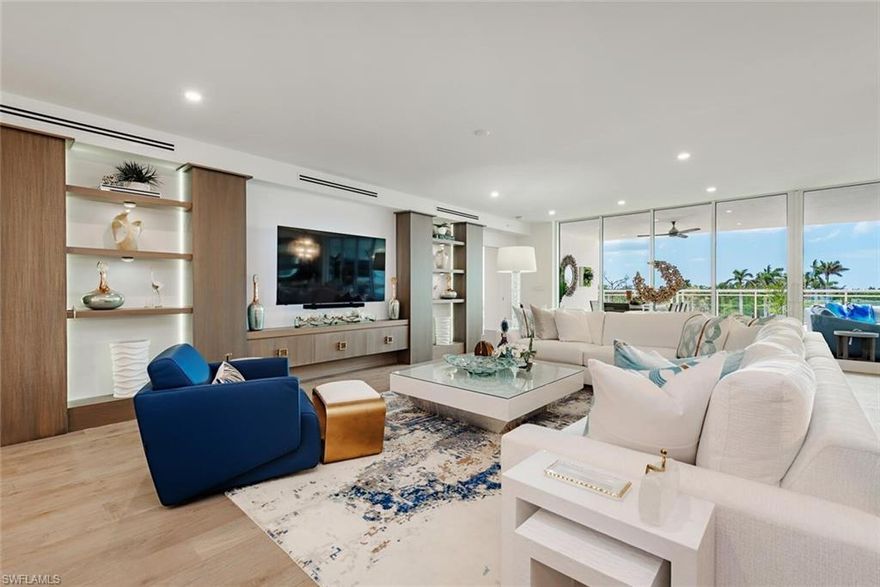 Welcome home to unit 302 in Tower 400, recently completed and beautifully finished, this Kalea Bay residence provides all the conveniences of living in a brand-new luxury condominium and a 5-star amenities center, a combination that has made Kalea Bay one of the most successful and desirable communities in Naples.  This residence features a wall of sliding glass doors leading to a unique expansive extended terrace totaling 1,242 square feet including 523 square feet of covered outdoor living plus 719 square feet of open balcony area.  The interior of the unit lives like a single-family home with 3,290 square feet of living space including 4 bedrooms and 4 full bathrooms including spectacular primary suite with a massive custom closet.  Highlights include stunning wall decor throughout plus impressive built-in units in the great room and the media room including back-lit wall panels that can be dimmed for movies.  The lighting fixtures are fabulous and eye catching as you enter the home and accentuate the finishes including wide plank oak wood floors, custom cabinetry and designer touches throughout the home.  The open gourmet kitchen features a Wolf gas cooktop and wall ovens, Sub-Zero refrigerator and full height wine cooler and a butler’s pantry with ample storage. The building features a rooftop terrace with a pool and spectacular sweeping views, an open-air fitness center, BBQ grills and an open-air lounge all ideal spots to take in stunning sunsets.   Tower 400 is located directly across from the Club at Kalea Bay and provides easy access to 80,000 square feet of exceptional modern amenities, including a wellness center with a state-of-the art gym, spin room, Pilates, spa services plus 3 resort style pools, 2 open-air poolside bars, fine and casual dining options, outdoor fire pits, a kids’ game room, 8 pickleball and 4 tennis courts, guest cottages and more. Kalea Bay Residents also have the option to join the annual Beach Card Program, based on availability, which grants access to the private Beach Club at Moraya Bay at Vanderbilt Beach for dining both indoor and outdoor as well as beach service including food, beverages, chairs and umbrellas.