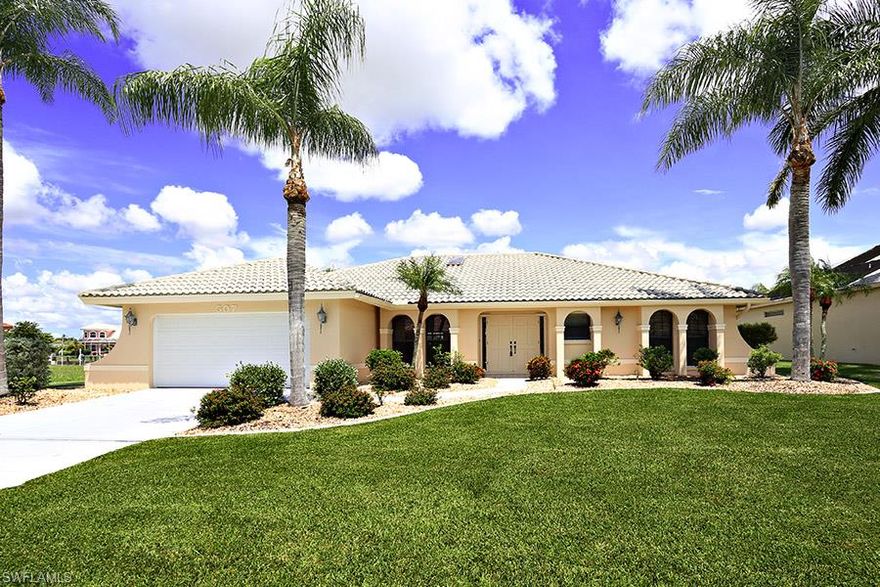 This is the house that any buyer would call a DREAM HOME. Located on the 8 lakes with incredible views of the lake and water views everywhere you look. Home features 3 bedrooms plus a study, open living area with volume ceilings and separate family room with cozy fireplace. Huge screened pool with electric heater. Hurricane shutters that will allow you to close off the whole lanai area in minutes. For you boater's there is a huge dock with composite decking and 10,000 pound boat lift. Plenty of room to hang out and enjoy the open breezes from the lake. This home will make you feel like you are in Paradise everyday..